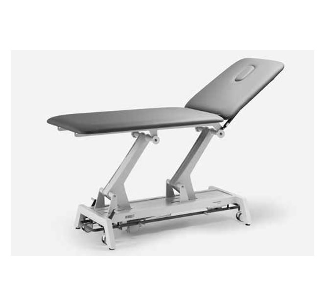 Table de physiothérapie réglable sur fond blanc.